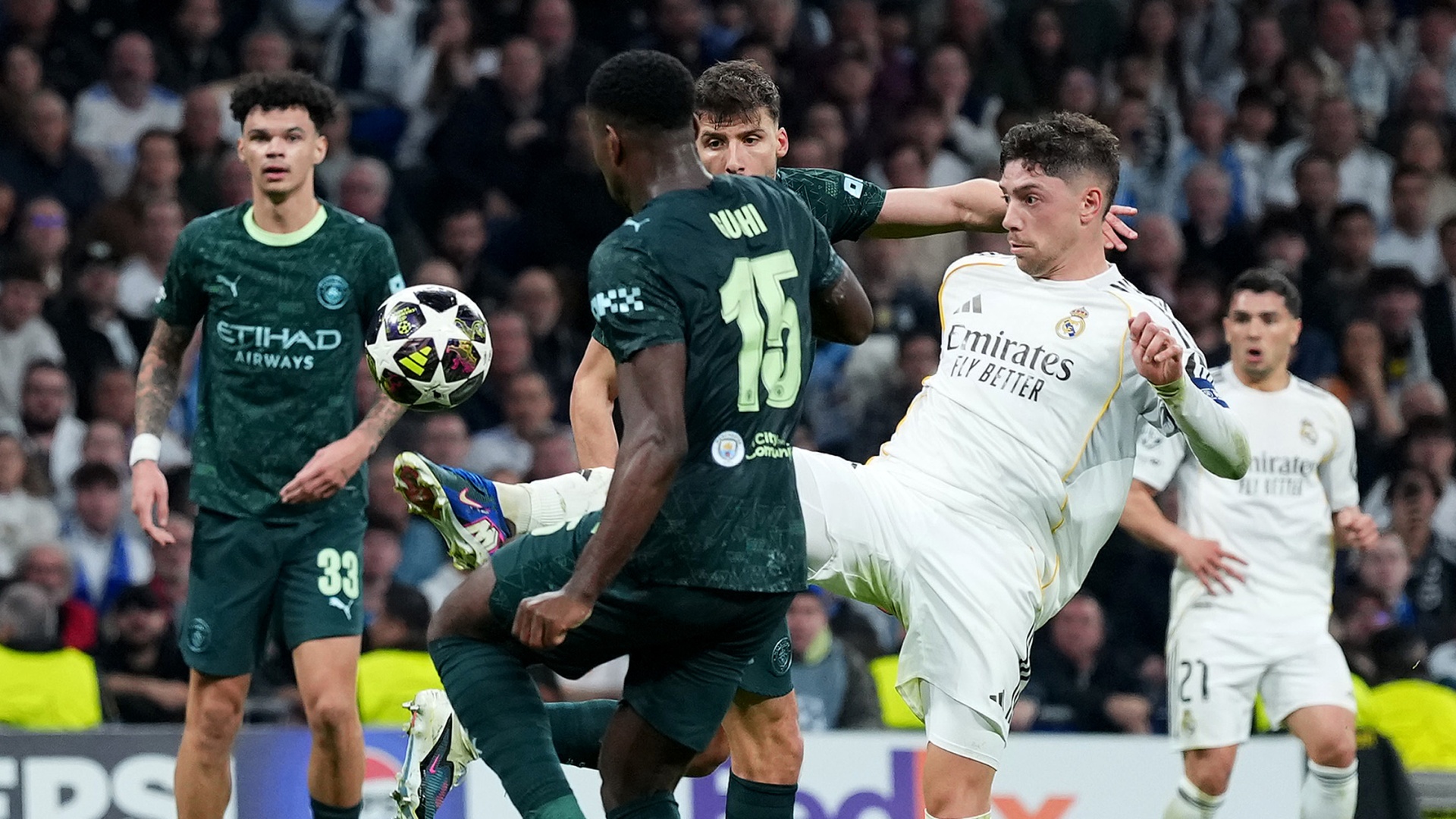 Fede Valverde flicks the ball over Marc Guehi's head during a Man City vs Real Madrid game in the 2025/26 Champions League