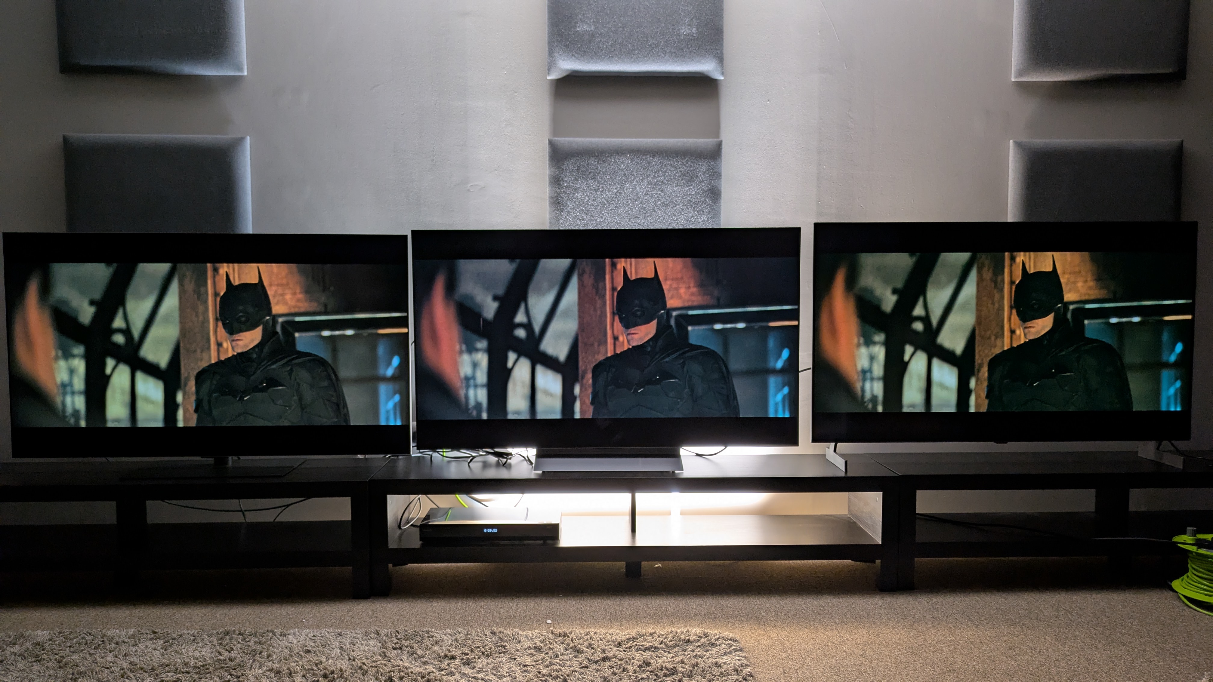 LG G6 (left) vs LG C6 (middle) vs LG B6E (right) showing Batman in penguin's office from The batman. The G6 shows the best shadow detail, with the C6 next, while the B6E shows some black crush