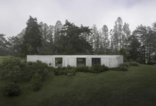Facade of Ballen house in Colombia among greenery, an Andes Mountain retreat