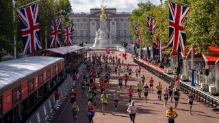 Runners approach the finishing line on The Mall at The 2021 Virgin Money London Marathon, Sunday 3rd October 2021