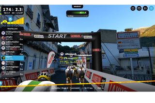 This image shows the start line for a Rouvy event with real images of Spain overlaid with animated 3D riders