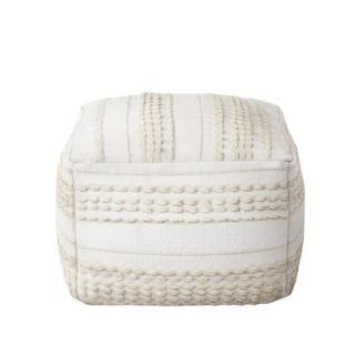 A white and beige patterned pouf