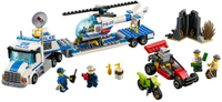 Give chase in this heavy-duty Helicopter Transporter and use the included dirt bike and tough dune buggy, as needed. Includes four minifigures with assorted accessories: two police officers and two bad guys.