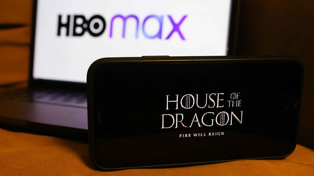 &amp;#039;House of the Dragon&amp;#039; series logo displayed on a phone screen and HBO Max logo displayed on a laptop screen are seen in this illustration photo taken in Poland on August 16, 2022.