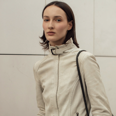 woman wearing a tan jacket