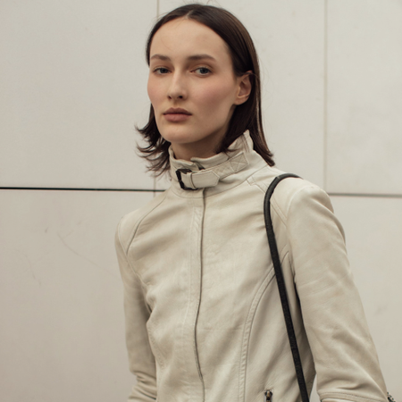 woman wearing a tan jacket