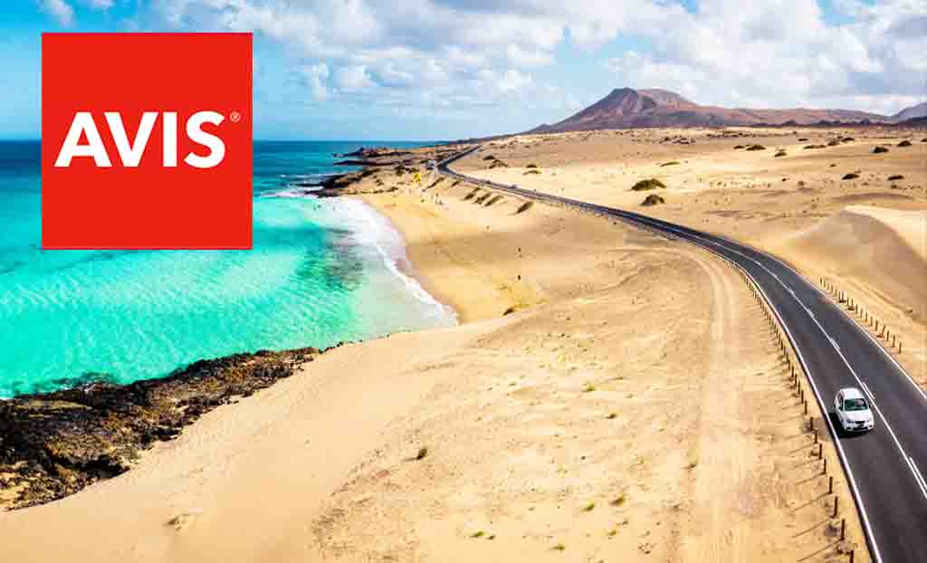 Avis logo placed over a birds eyeview of a desert with a road and sea 