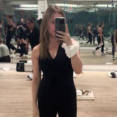 Nikki wears a workout onesie at Tracy Anderson.