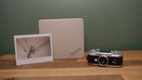 The Fujifilm Instax Link Wide 2 photo printer on a bookshelf