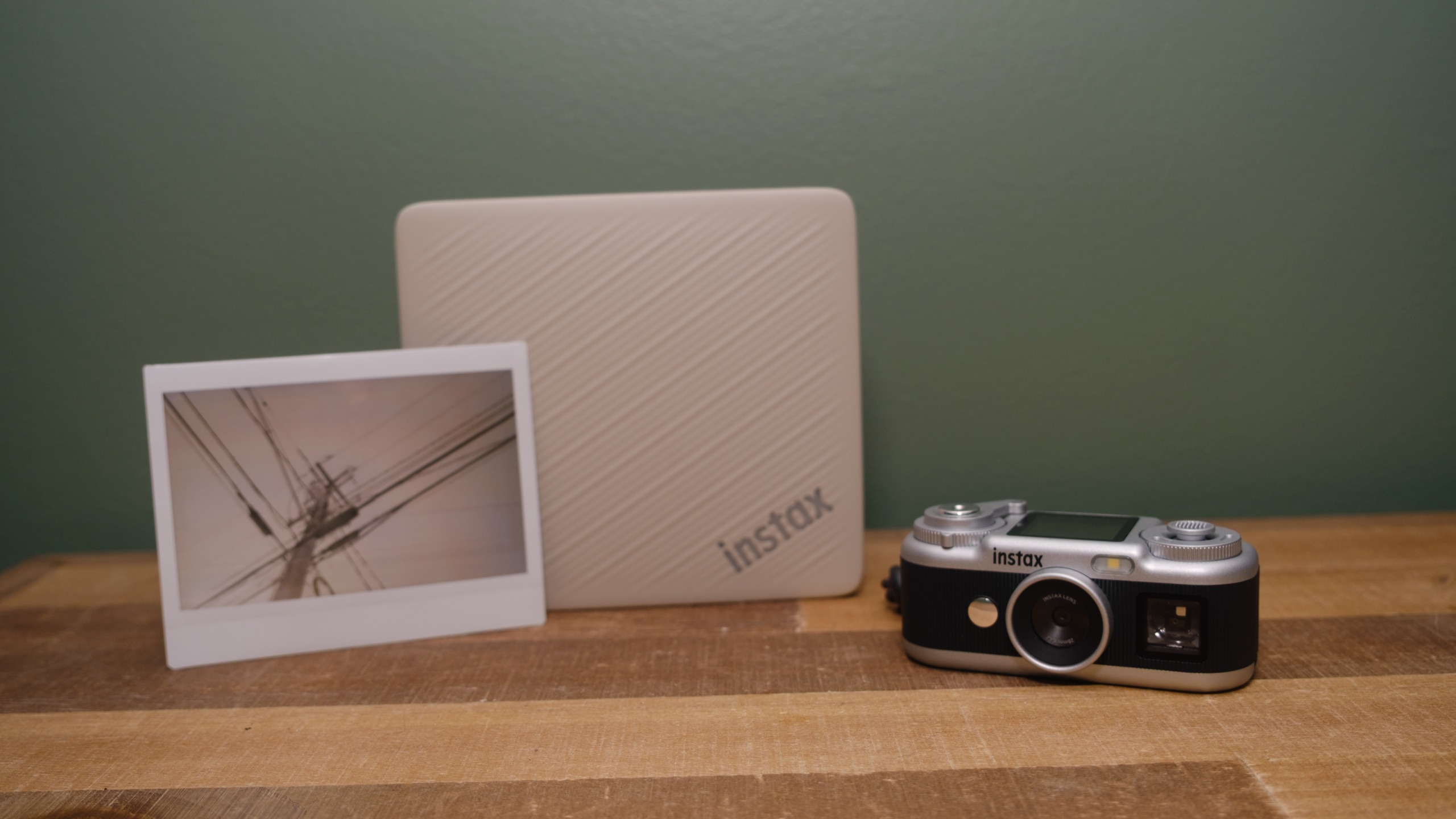 The Fujifilm Instax Link Wide 2 photo printer on a bookshelf