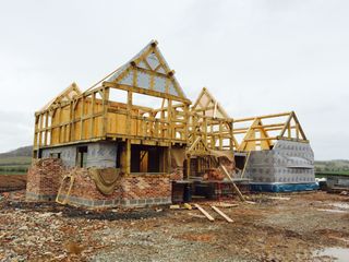 an oak frame house under construction