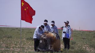 Officials prepare to recover the Chang'e-6 moon probe in its landing spot in Inner Mongolia on June 25, 2024.