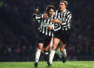 Alessandro Del Piero of Juventus (left) is congratualted by teammate Alen Boksic after scoring a penalty to put Juventus 0-1 ahead of Manchester United during the champions league match at Old Trafford, Manchester. Juventus won the match 0-1.