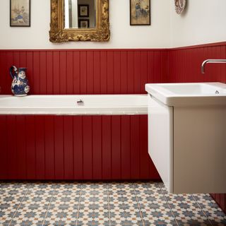 red bathroom with patterned tiles