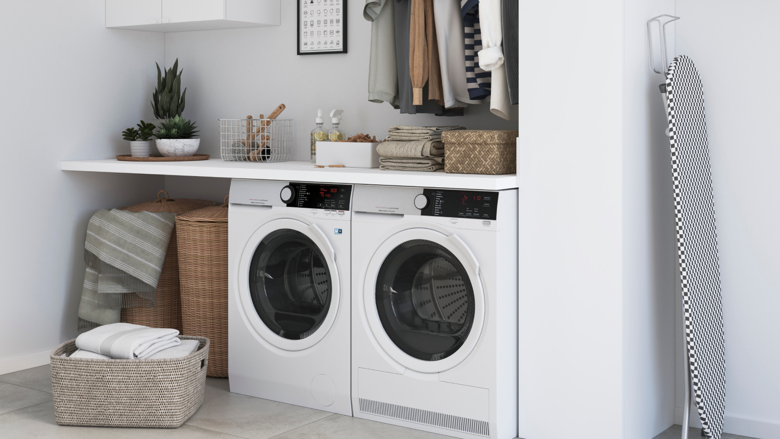 white freestanding washing machine and tumble dryer next to each other under worktop in white utility room