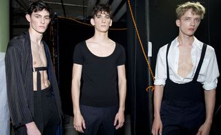 Male models wearing black tshirts and trousers from the Dries Van Noten SS2015 collection