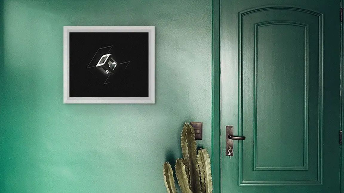 Tokenframe; a photo of a digital art display against a green wall