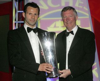 Manchester United manager Sir Alex Ferguson presents Ryan Giggs with his Player of the Year award in May 2006.