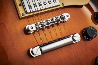 Yamaha SG1820: The original, more ornate stud tailpiece of the SG2000 is replaced here with very fit-for-purpose TonePros hardware.