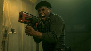 Roland (Kevin Hart) shouts and aims his rifle down a corridor in the "Borderlands" movie