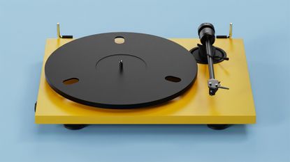 Pro-Ject E1.2 BT turntable in yellow on blue background