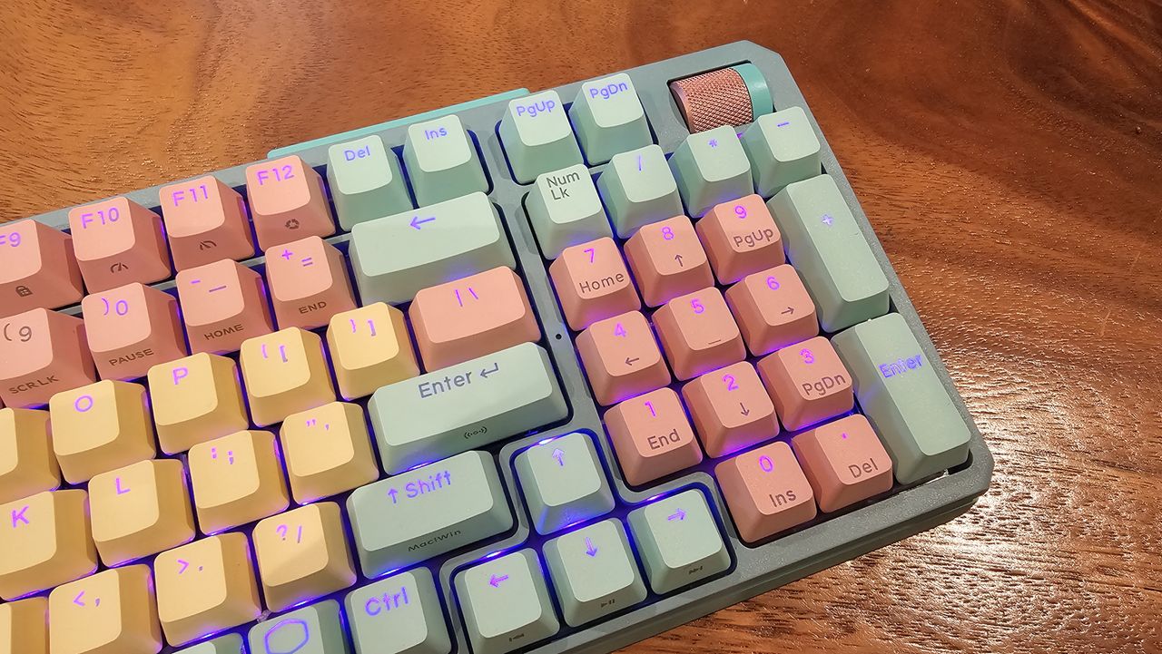 angled close up of upper right corner of Cooler Master MK770 showing volume roller and number pad