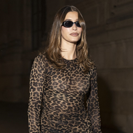Hailey Bieber was spotted leaving Loulou club during Paris Fashion Week, rocking a leopard print dress paired with high boots and platform heels. The model&rsquo;s chic style was elevated with black sunglas