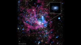 A deep space image showing a faint blue X-ray source at the center which indicates the existence of Sagittarius A*.