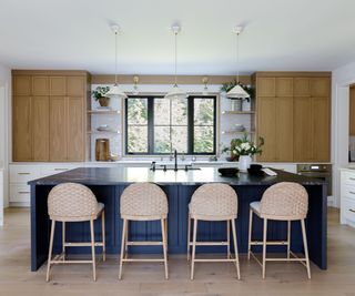 Blue, white and wood kitchen with wooden kitchen flooring