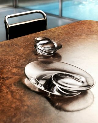 Zaha Hadid Design tableware: sculptural clear glass bowls on table