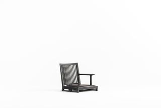 ‘Liku’ legless chair in beech and leather