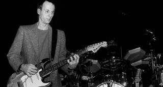 A B/W image of Adrian Belew with his number one Strat, circa 1981