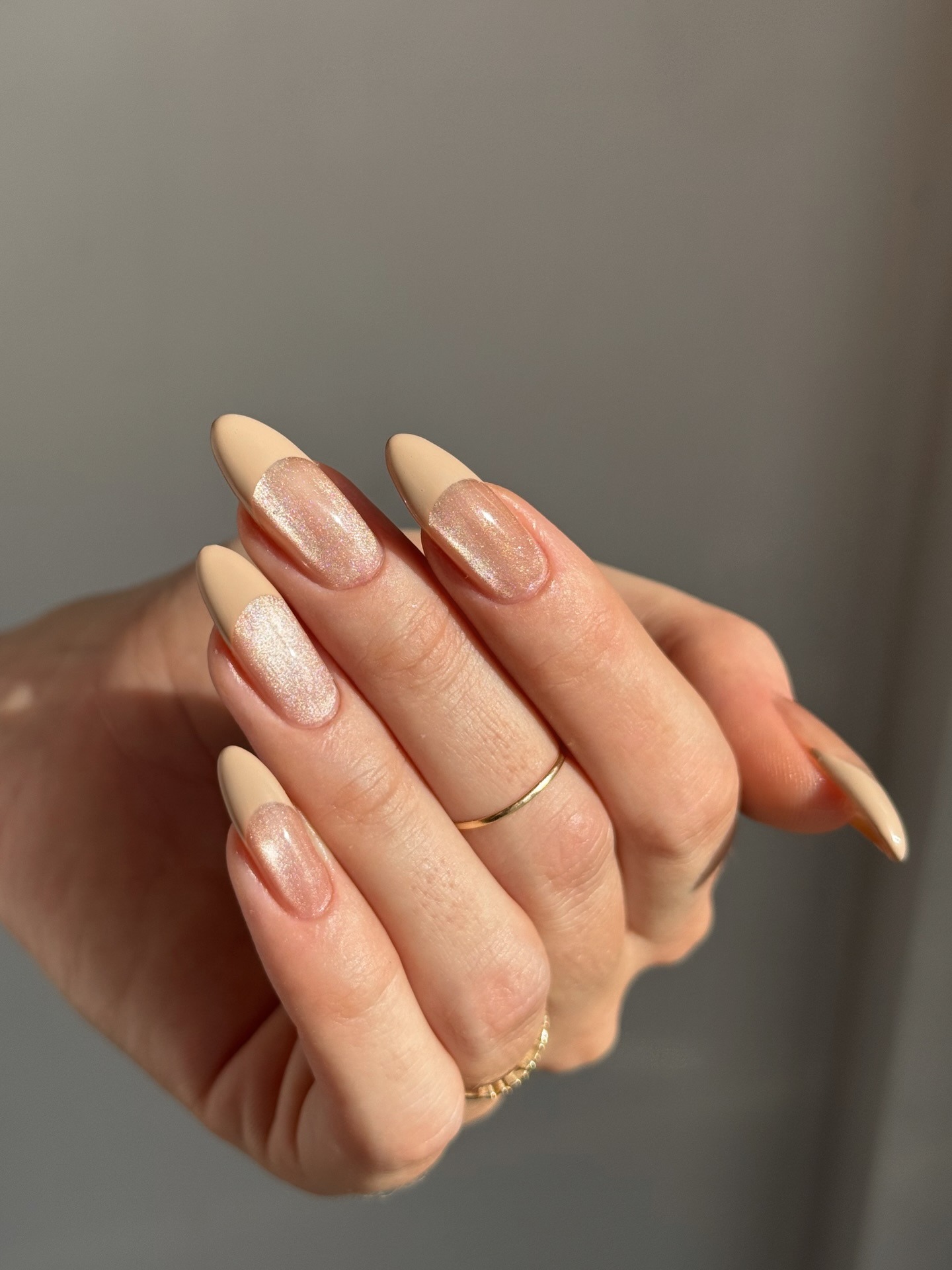 A cat-eye manicure with a nude French tip