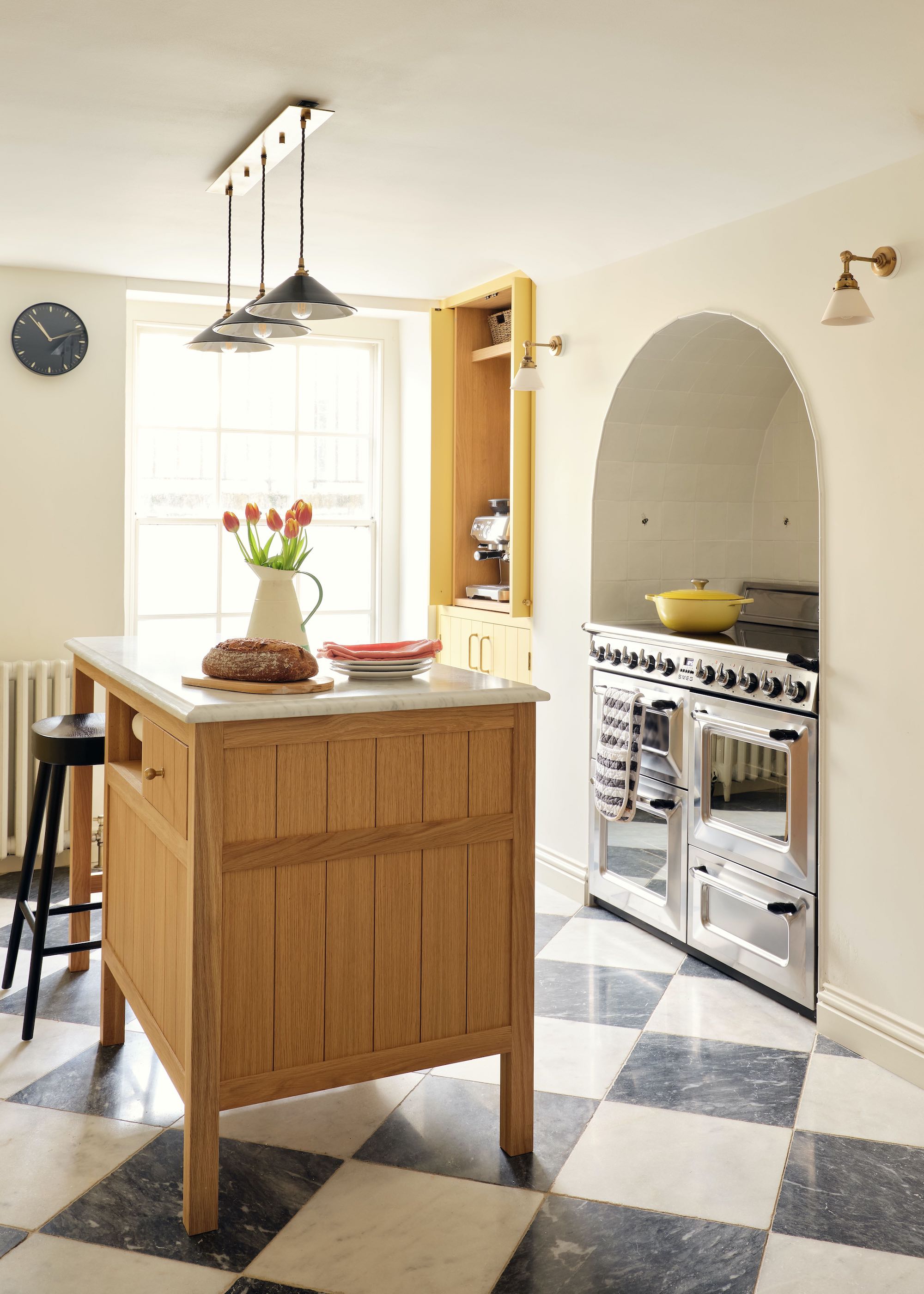 kitchen with wood island and steel range cooker