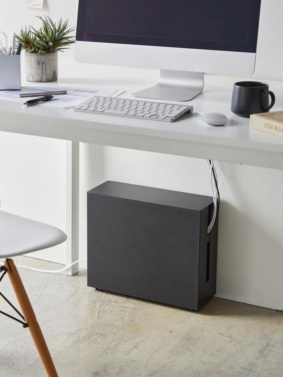 A home office with a black cable box from Yamazaki