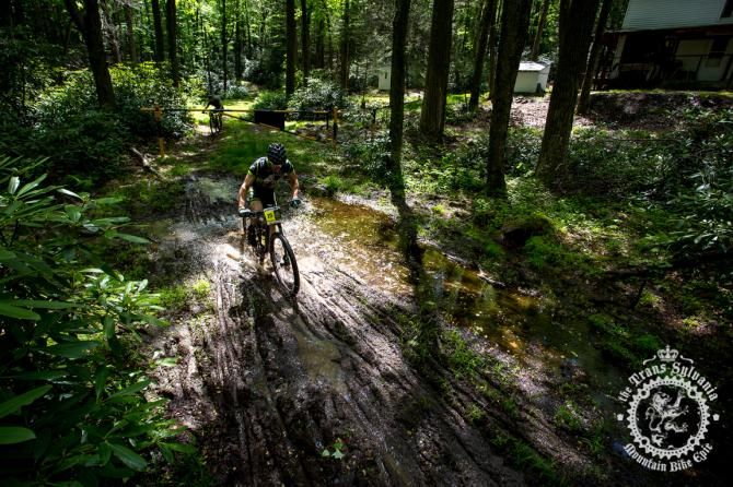 Madison Matthews accelerates through a muddy sectio n on Wert Path