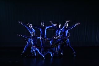 Using hoops, AstroDance dancers present an abstract representation of Black Holes merging.