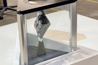 Lunar sample 76015,143, collected by the Apollo 17 crew in 1972, is a 0.7 pound (333 gram) slice of a larger rock that was chipped off a boulder on the moon. It is now on display in the Oval Office in the White House.