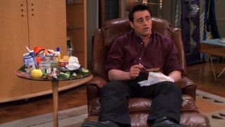 Joey (Matt LeBlanc) looks sick after eating everything in the fridge on Friends.