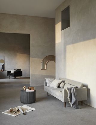 Modern grey living room with concrete walls