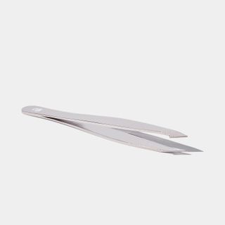 A pair of Eyeko tweezers set against a gray background.