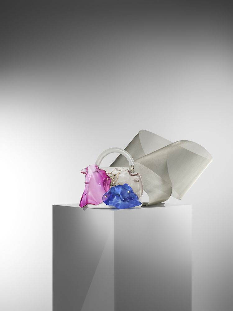 Louis Vuitton x Frank Gehry Limited-Edition Handbag Collection's coinciding exhibition boasts gigantic fish-shaped sculptures and similarly inspired bags in a stunning presentation.