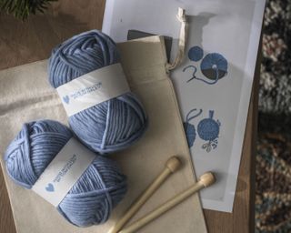 blue knitting craft kit with wooden needles