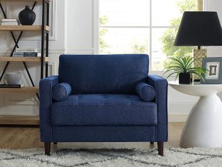 wide navy armchair in a living room