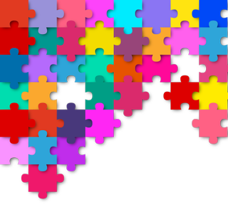 Multicolored puzzle pieces fill up half of a white background.