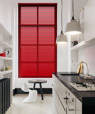 Luxurious red aluminium venetian blinds in modern kitchen