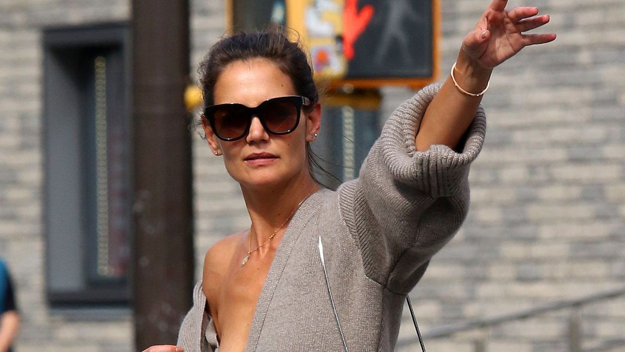 Katie Holmes shows major cleavage while hailing cab with Suri Cruise in NYC