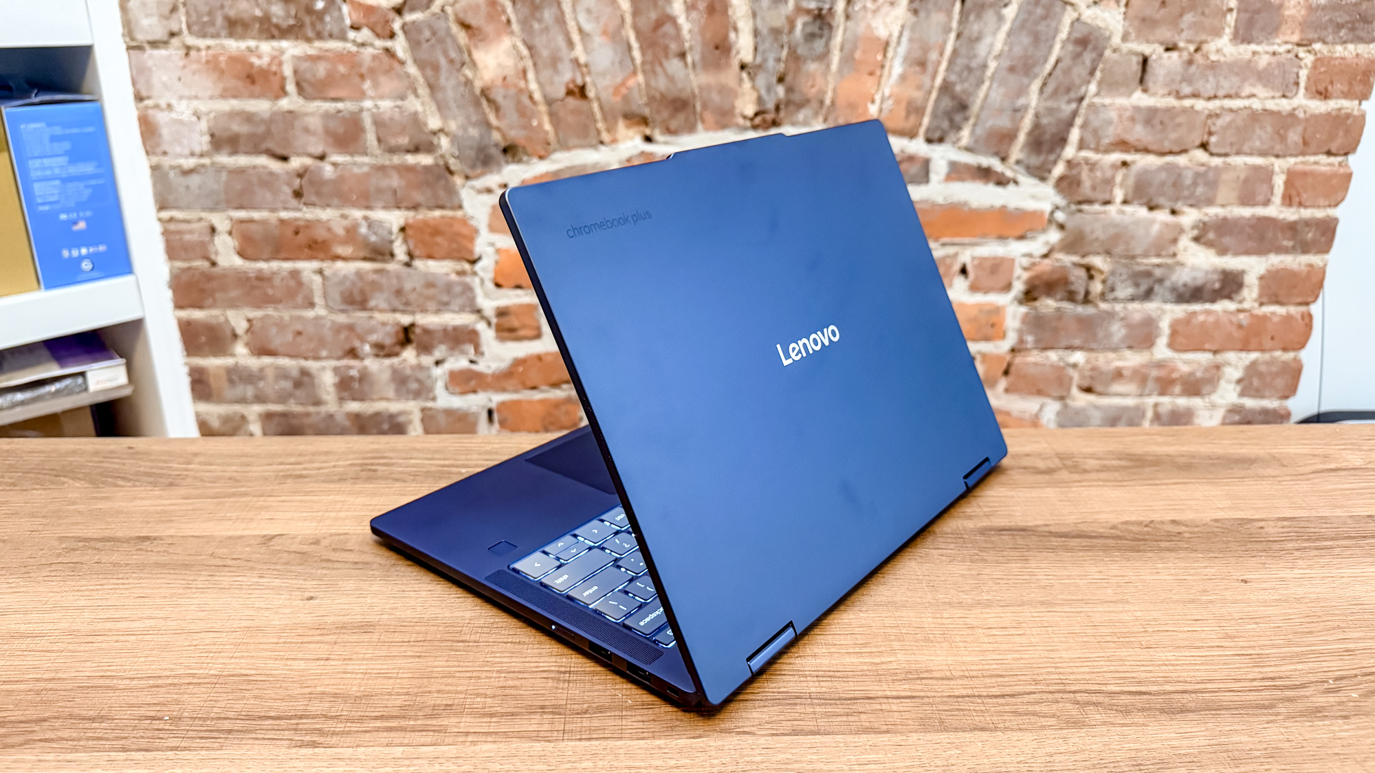 The Lenovo Chromebook Plus 2-in-1 Gen 10 with its lid open seen from behind