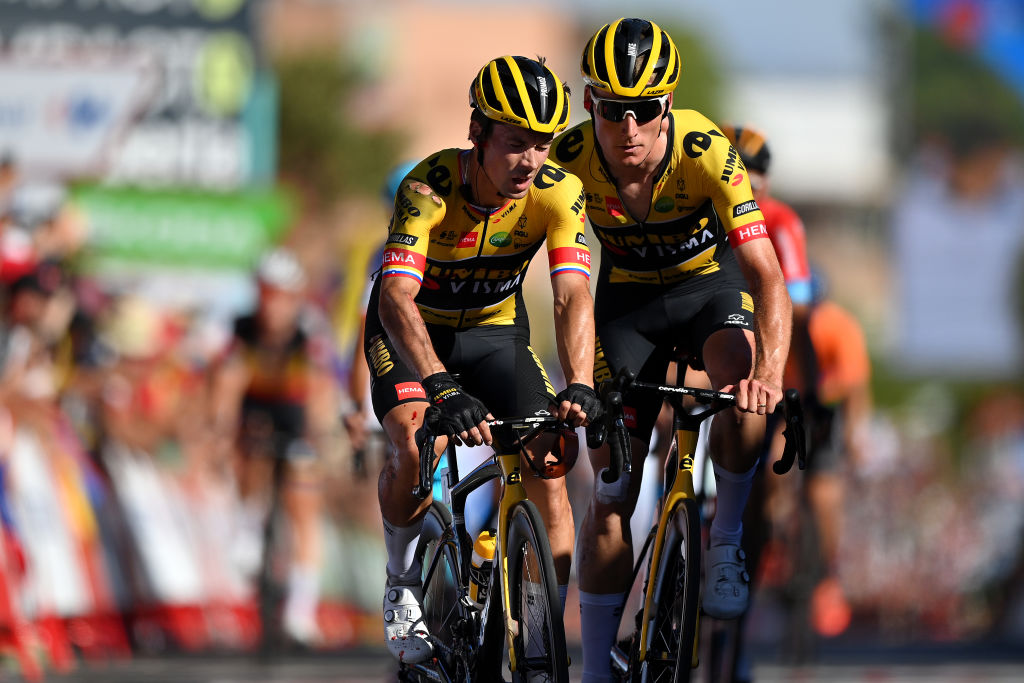 TOMARES SPAIN SEPTEMBER 06 LR Primoz Roglic of Slovenia injured after being involved in a crash in the final sprint and Mike Teunissen of Netherlands and Team Jumbo Visma cross the finish line during the 77th Tour of Spain 2022 Stage 16 a 1894km stage from Sanlcar de Barrameda to Tomares LaVuelta22 WorldTour on September 06 2022 in Tomares Spain Photo by Justin SetterfieldGetty Images