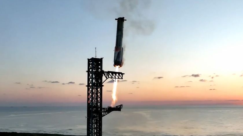 SpaceX&#039;s Starship Flight 5 Super Heavy booster approaches its launch tower for the first-ever landing and capture at the pad after launching on a suborbital test flight from Starbase in South Texas on Oct. 13, 2024.